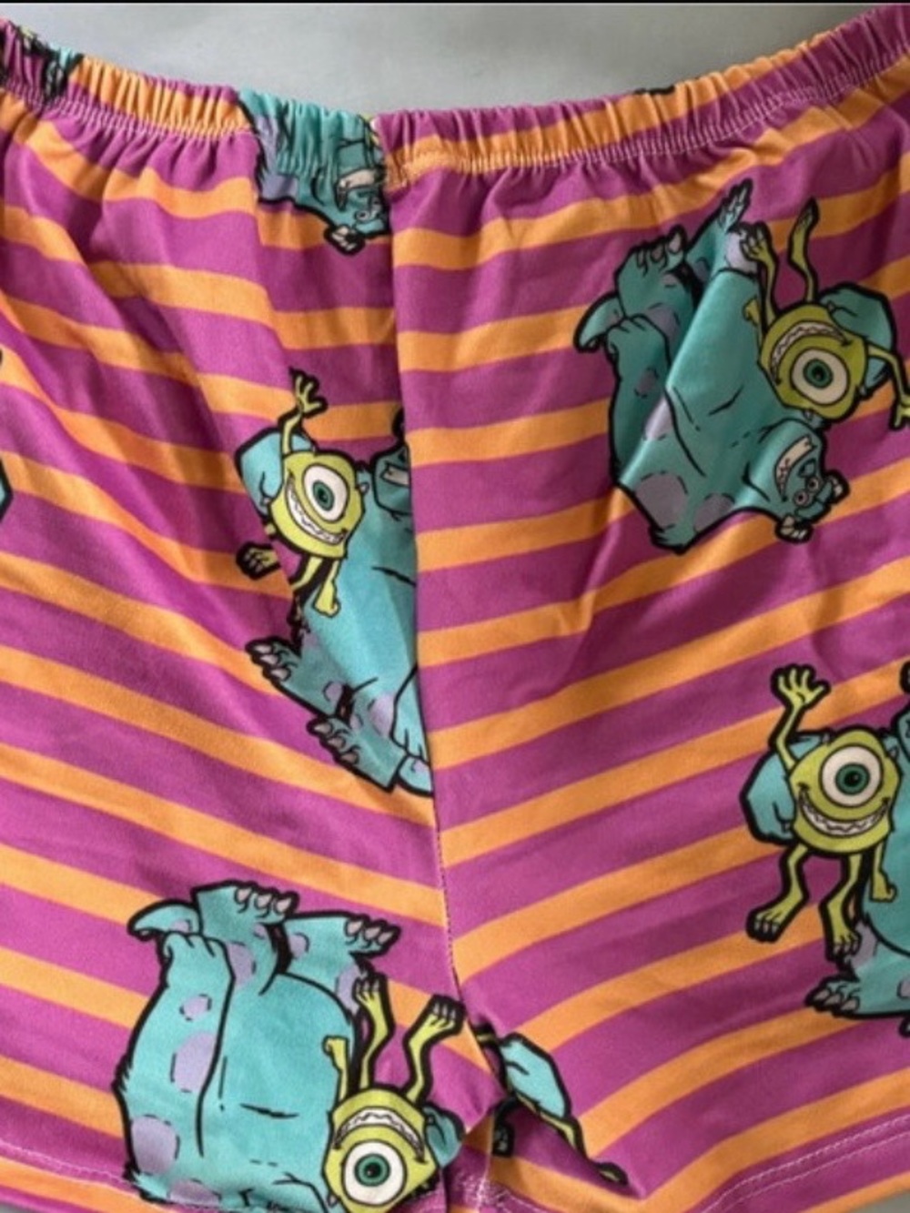 Woman’s monsters inc Pink & orange Striped Pajama Shorts with Monster Print